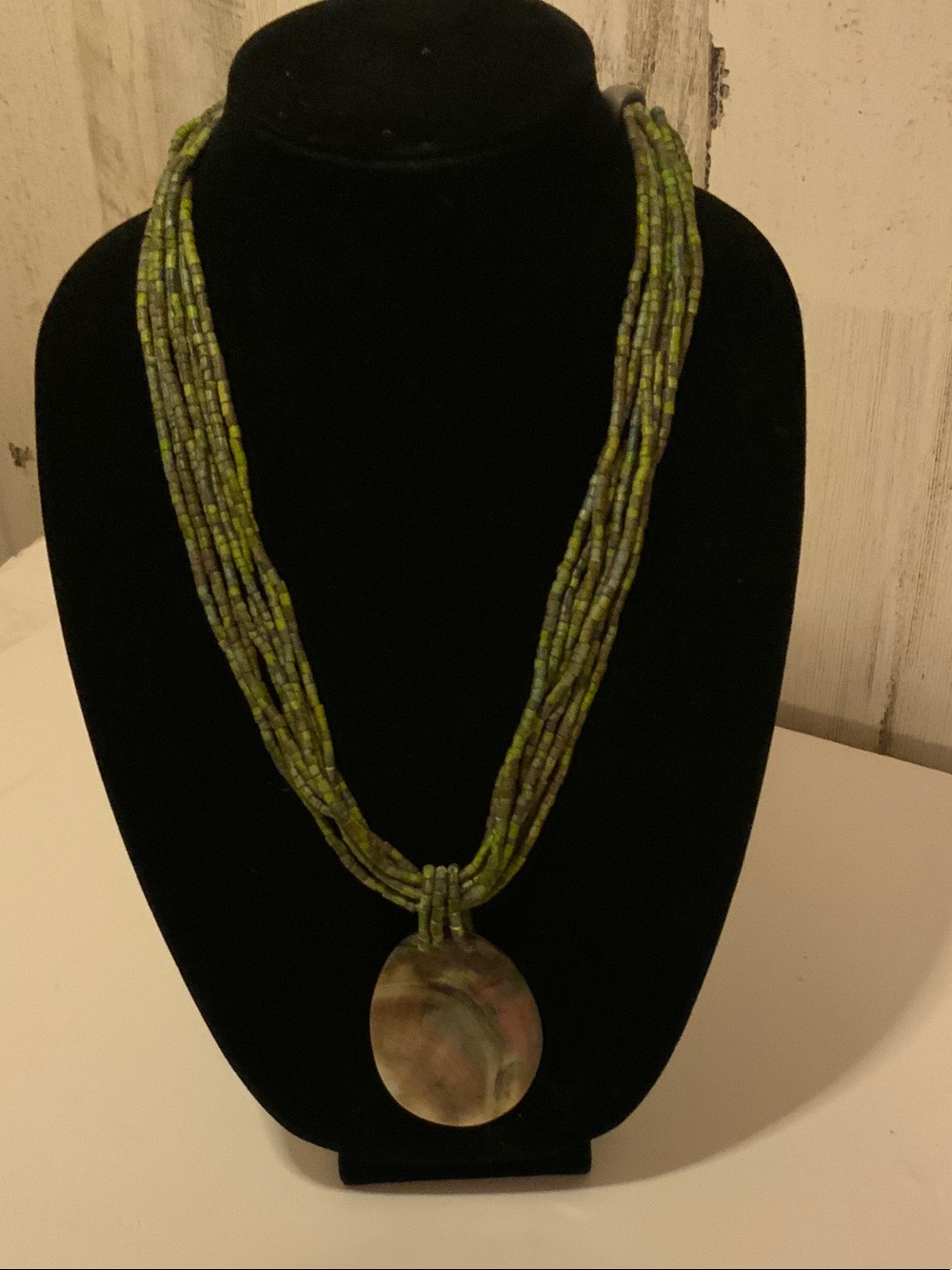 Green Multi-Strand Beaded Necklace with Shell Pendant